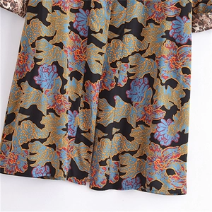 Floral print long sleeve kimono dress with leopard patchwork cuffs in a relaxed fit