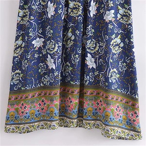 Women's V-neck boho floral dress in navy blue with ethnic hem and tassel details