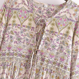 Women's V-neck paisley print tunic with tassel ties and metallic bead details