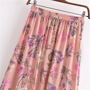 Detail of the elastic waistband and floral print on women's cotton maxi skirt