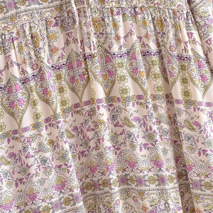 Bohemian V-neck printed dress with floral paisley pattern and tassel drawstring details