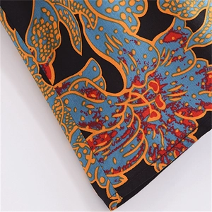 Detail shot of bohemian floral print and stitching on a long sleeve cotton kimono dress