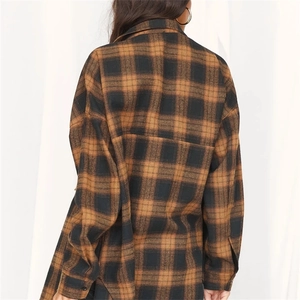 Back view of a loose fit plaid cotton shirt featuring vintage brown and black checkered pattern