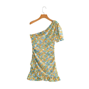 Detail of floral one-shoulder mini dress with ruffled hem and ruched side styling