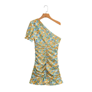 Detail of ruched floral dress with one-shoulder bubble sleeve and ruffled hem design