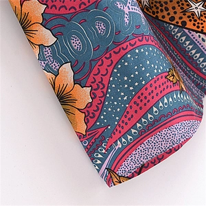 Detailed view of bohemian paisley and floral print on woven rayon fabric sleeve