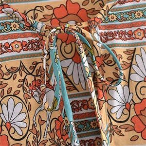 Robe longue bohème à manches longues avec imprimés floraux licorne et col à glands