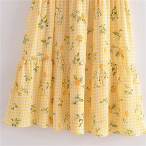 Robe française à carreaux jaunes avec motif citron et ourlet à volants étagés