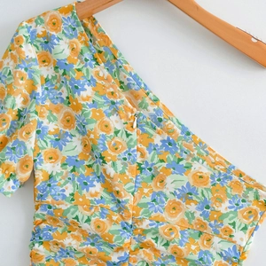 Slim fit one-shoulder floral print mini dress with side ruching and zipper detail