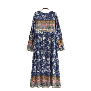 Bohemian dark blue floral maxi dress with V-neckline and intricate geometric patterns