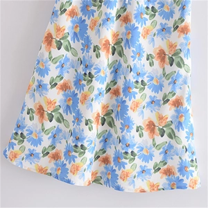 Robe longue style français à imprimé marguerites blanches, bleues et oranges col V