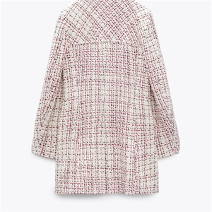 Detail view of the back of a slim fit tweed coat with pink and black texture on white
