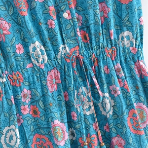 Bohemian floral V-neck dress in turquoise with tassel waist and mandala print detail