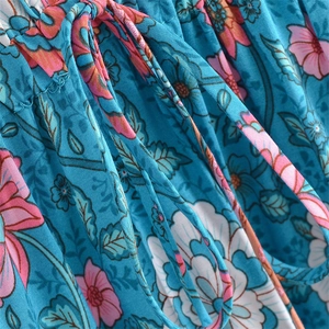 Bohemian V-neck floral dress in lake blue with tassel drawstring and waist tie details