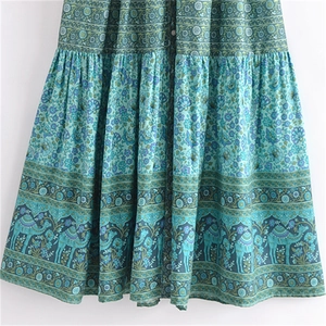 Bohemian floral maxi dress with turquoise ethnic print and camel pattern hemline