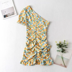 Floral off-shoulder mini dress with ruched body and ruffle hem on white linen background