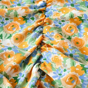 Chic floral off-shoulder mini dress featuring vibrant prints and ruched bodycon details