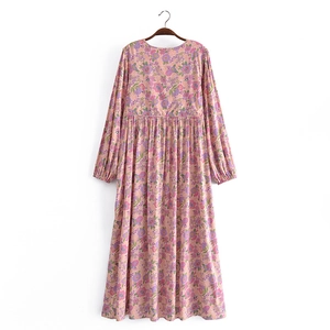 Detail of floral V-neck midi dress featuring vibrant purple and blue flower prints