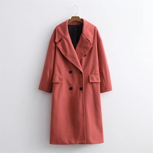 Coral pink long double-breasted wool coat with large lapels and cocoon fit