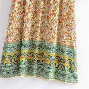 Robe longue bohème à fleurs avec motifs chameaux et pompons en tissu de viscose doux