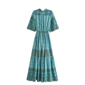 Bohemian V-neck maxi dress with ethnic floral patterns and tassel drawstring waist