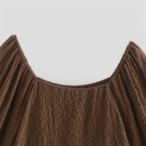 Deep brown slim fit textured bodysuit with square collar and puff sleeve details