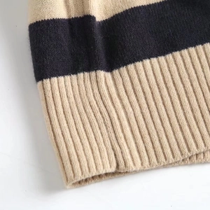 Women's V-neck striped knit sweater in beige and black with ribbed hem detail