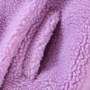 Chic purple faux shearling long coat featuring a stylish notched lapel and cozy texture