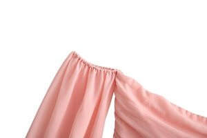 Close-up of pink chiffon dress showing elastic pleated texture and fine stitching detail