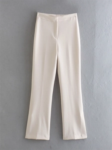 Detailed view of high waist cream white straight trousers with premium smooth texture