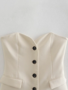 Slim-fit beige corset vest top with front buttons and symmetrical flap pockets