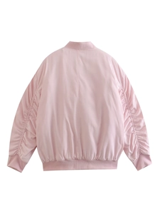 Back view of pink bomber jacket showing shirred sleeve details and ribbed hem