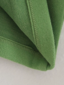 Women's green soft lapel jacket featuring detailed knit fabric and fleece lining