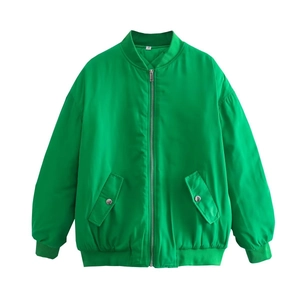 Detail of bright green bomber jacket with silver zipper and ribbed knit collar