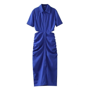 Detailed view of royal blue shirt dress with waist cut-outs and pleated skirt details