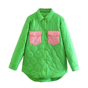 Women's green quilted shirt jacket with contrasting pink pockets and buttons