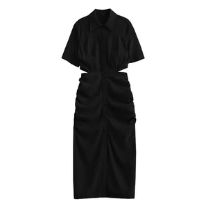 Detail of black cut-out dress with turn-down collar and ruched texture details