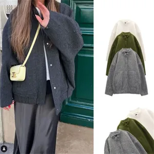 Detail of loose-fit wool blend utility jacket with drop shoulders and single-breasted front
