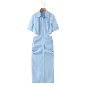 Detailed view of light blue shirt dress with waist cut-outs and pleated design accents