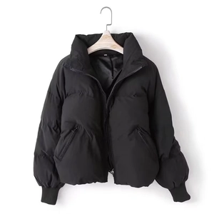 Women's black thick hooded puffer jacket with quilted design and zip pockets