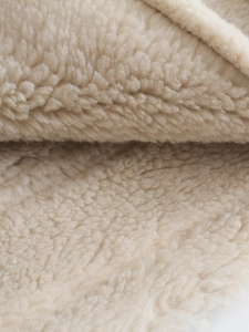 Winter faux fur jacket in beige featuring soft fleece texture and stylish warm lapel