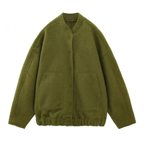 Detail of olive green textured fleece bomber jacket featuring large square front pockets