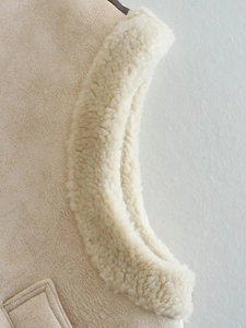 Detail of faux suede vest with plush sherpa lining and premium stitching craftsmanship