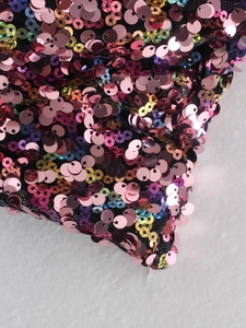 Detailed close-up of colorful sequins on mesh fabric for a stylish Y2K tube top design