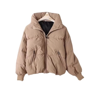 Women's thick khaki puffer jacket with standing collar and zip pockets in a loose fit style