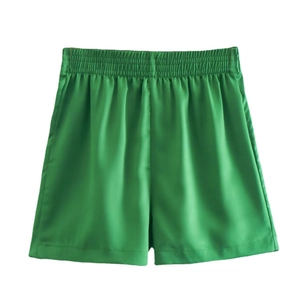 Women's emerald green elastic high waist satin shorts with glossy finish and A-line fit