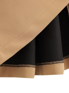 Detaillierte Makroansicht der khakifarbenen Twill-Stoffstruktur und schwarzen Saumnaht