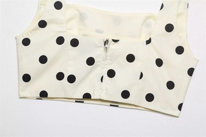 Detail of the back metal zipper closure on the black polka dot crop top camisole