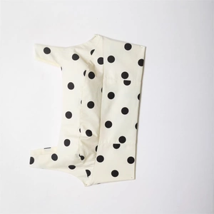 Polka dot cropped camisole top in cream white with bold black dots for summer fashion