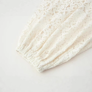 White lace pants featuring floral hollow patterns and elastic cuff details for summer